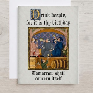 May include: A greeting card featuring a medieval-style illustration of four figures drinking from goblets. The text reads: Drink deeply, for it is thy birthday. Tomorrow shall concern itself. The design includes a large decorative letter D.