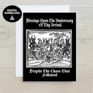 May include: A black and white greeting card with the text "Blessings Upon The Anniversary Of Thy Arrival" and "Despite The Chaos That Followed". The card features a vintage illustration of figures around a table.