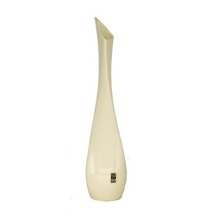May include: A tall, cream-colored vase with a slender, curved body and a unique, angled opening. The vase has a glossy finish and a small, rectangular label near the base. This decorative vase is ideal for displaying flowers or as a standalone art piece.