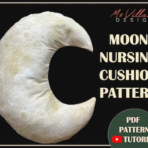 May include: A white crescent moon-shaped nursing pillow with a textured surface resembling the moon's craters. The pillow is on a black background with the text "Ms Villana DESIGN MOON NURSING CUSHION PATTERN PDF PATTERN TUTORIAL" in white and green.