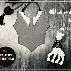 May include: A gray and white bib with a white collar and the text "Wednesday bib pattern" on a wooden background.