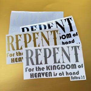May include: Four vinyl decals with the text "Repent for the Kingdom of Heaven is at hand" in different colors and fonts. The text is in a stylized font with a decorative border. The bottom decal includes the scripture reference "Matthew 3:2".