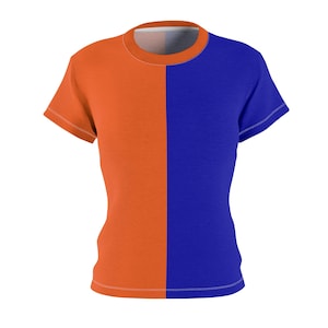 Puede incluir: Camiseta de manga corta con diseño de bloques de color. Dividida verticalmente, con la mitad izquierda en naranja vibrante y la derecha en azul profundo. Cuello redondo. La camiseta es de tejido suave.