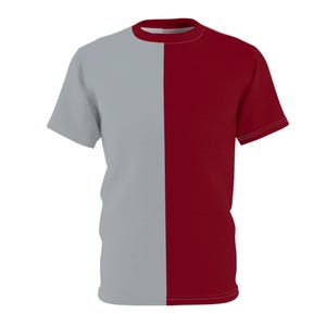 May include: A short-sleeved t-shirt with a colour-block design. The shirt is divided vertically, with the left side in a light grey and the right side in a deep red. The collar and sleeves have a matching red trim.