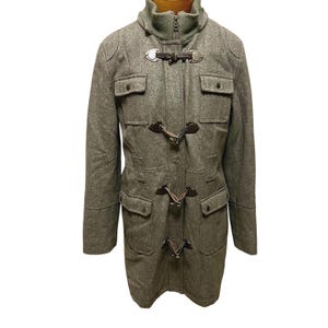 May include: A gray wool toggle coat with a high collar and multiple brown leather toggles.