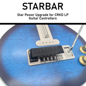 May include: A guitar controller upgrade kit featuring a black Starbar component, a white support, and a silver bar. The background is a blue guitar body. Text reads "STARBAR" and "Star Power Upgrade for CRKD LP Guitar Controllers."