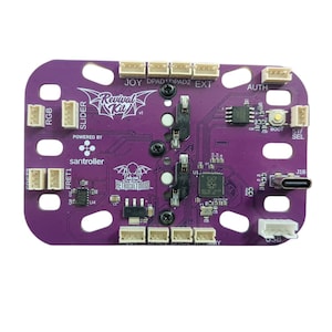 May include: Purple printed circuit board with various connectors and a USB-C port. The board has the text "Revival Kit" and "santroiler" printed on it.