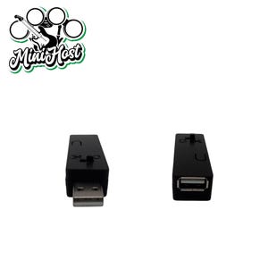 May include: Two black USB adapters with a USB-A port on one end and a USB-C port on the other end.
