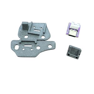 May include: A set of three 3D printed parts for a Raspberry Pi project. The parts are gray and include a base, a connector, and a small rectangular piece.