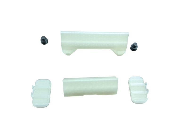 May include: A set of five white plastic pieces, including two long rectangular pieces with a slight curve, two smaller rectangular pieces, and a small round piece.