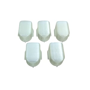 May include: Five white plastic caps for a product, possibly for a bottle or container.