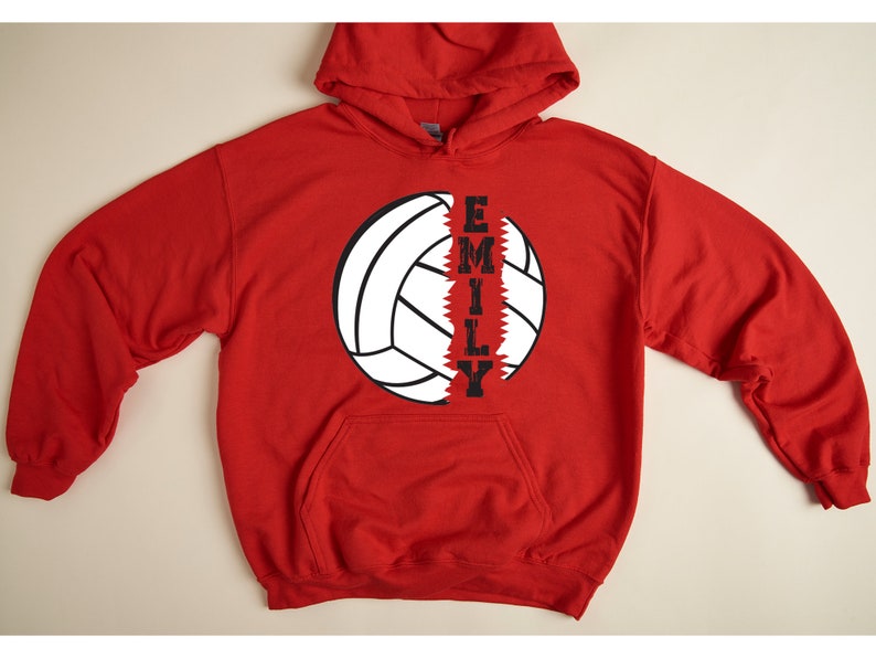 May include: Red hooded sweatshirt with a white volleyball graphic and the name "EMILY" printed vertically down the side of the ball.