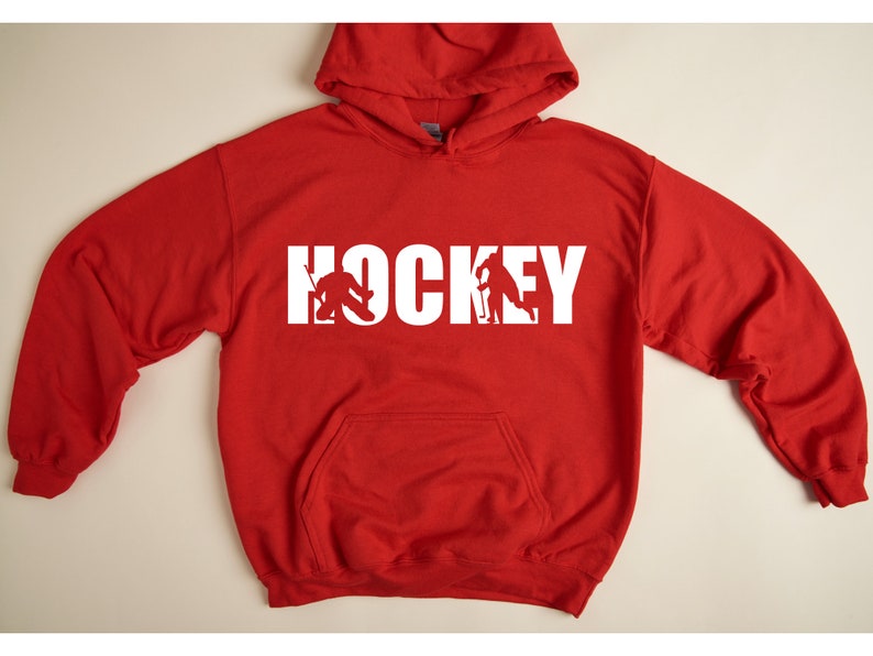 May include: Red hooded sweatshirt with white text that says "HOCKEY" with a hockey player silhouette inside each letter.