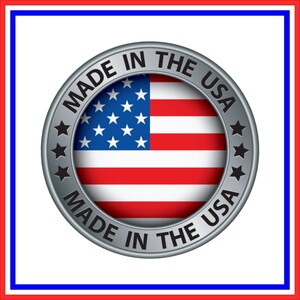 May include: A silver circular badge with the text "Made in the USA" around the edge. The centre of the badge features a red, white and blue American flag.