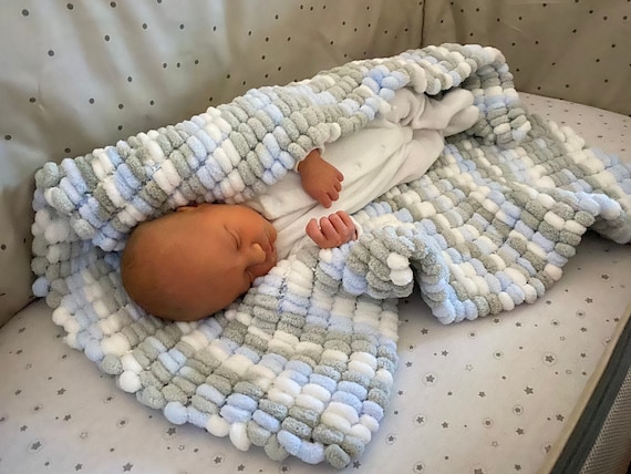 Handmade knitted pom pom baby blanket hotsell