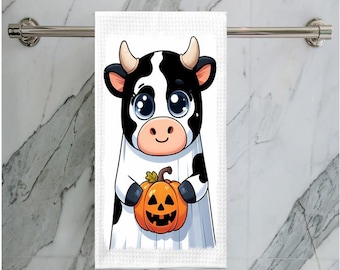Adorable Baby Cow holding a Halloween Pumpkin Kitchen Towel