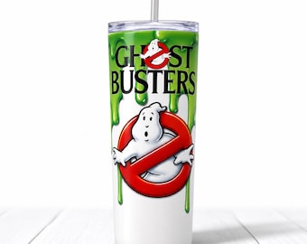 May include: A white cylindrical tumbler with a clear lid and straw, featuring a green slime drip pattern at the top. The Ghostbusters logo is printed in the centre with a white ghost inside a red circle, and the text GHOSTBUSTERS in black letters.