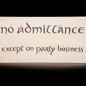 May include: A sign with the text "no admittance except on party business" written in a decorative font.