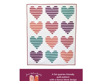May include: A quilt pattern featuring a white background with 12 striped hearts in various colours, including red, pink, purple, teal, and green. The text "Love Boldly" is at the top of the image. The text "from bolt to beauty" and "BY MICHELLE CAIN" is at the bottom of the image. The text "A fat quarter-friendly quilt pattern with a bonus block design" is also at the bottom of the image. The text "child | small throw | large throw" is at the bottom of the image.