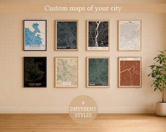 May include: Eight framed city map prints in various colors and styles, including blue, black, and green. The text "Custom maps of your city" is at the top, and "8 DIFFERENT STYLES" is in a circle at the bottom.
