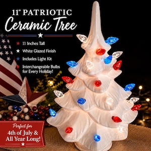 May include: A white ceramic tree with red, white, and blue lights. The tree is 11 inches tall and has a white glazed finish. The text on the image says "11" Patriotic Ceramic Tree". The tree includes a light kit and interchangeable bulbs.
