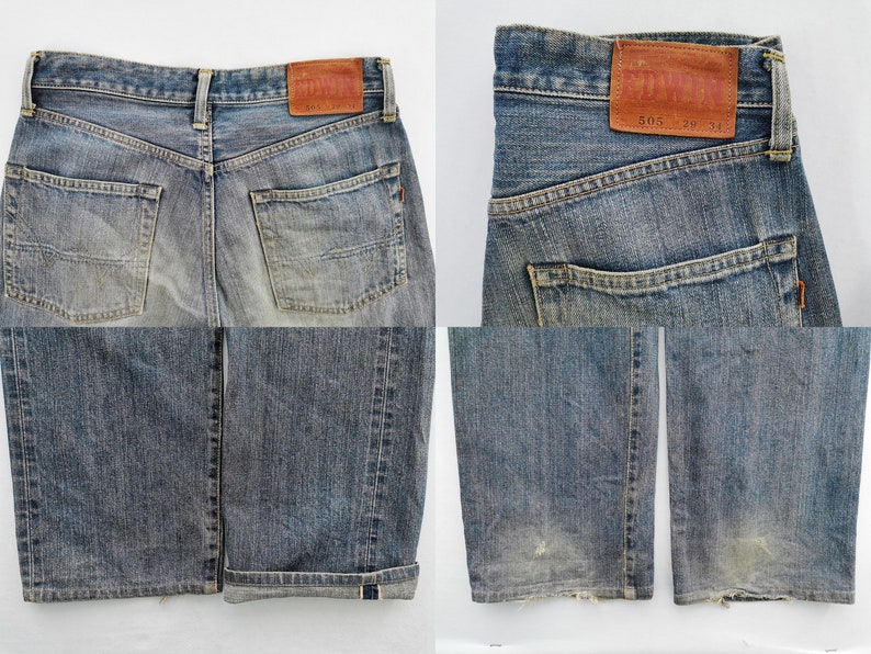 May include: Faded blue denim jeans with a classic five-pocket design. The jeans feature a leather patch with the brand name and size details. The cuffs are rolled up, revealing a contrasting fabric. The jeans have a worn look.