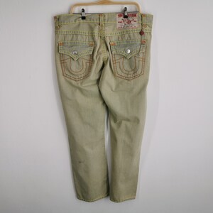 May include: A set of three ceramic mugs with a speckled, matte finish. The mugs are in shades of cream, light gray, and dark gray. Each mug has a simple, minimalist design, perfect for coffee or tea.