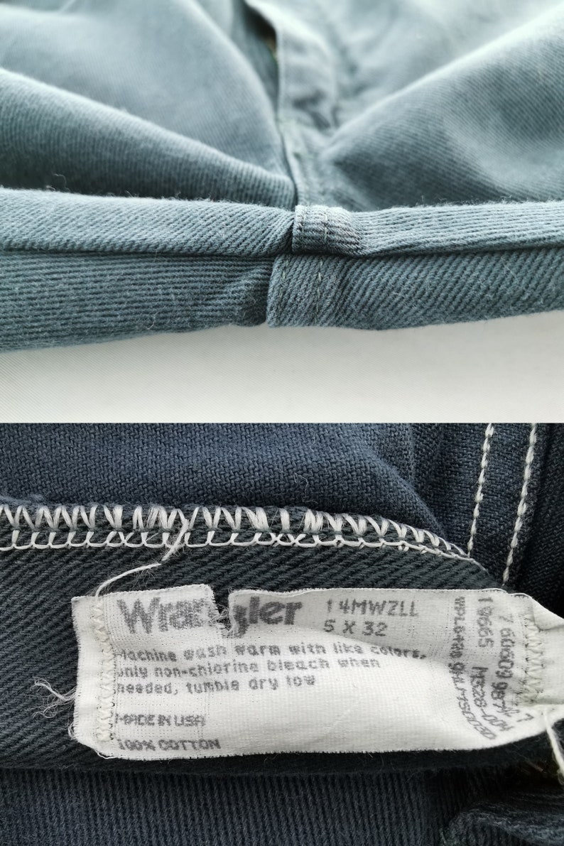 K&ouml;nnte beinhalten: Nahaufnahme einer blauen Jeans, die den gefalteten Saum und ein Etikett zeigt. Das Etikett tr&auml;gt die Aufschrift "Wrangler" und enth&auml;lt Gr&ouml;&szlig;enangaben: 5 x 32. Die Jeans besteht aus 100 % Baumwolle und ist maschinenwaschbar.