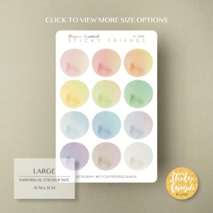 May include: A sheet of 12 large, round, watercolor stickers in various pastel colors. Each sticker is 3 inches in diameter. The stickers are labeled "Sticky Friends" and "Planner Essential".