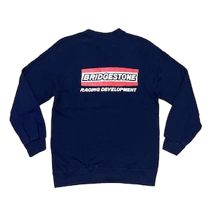 May include: A navy blue sweatshirt with a red and white logo that says "BRIDGESTONE RACING DEVELOPMENT"