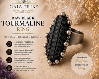 May include: A raw black tourmaline ring featuring a long, vertically striated black stone set in a metallic band surrounded by small silver-toned spheres. The image includes text: GAIA TRIBE RAW BLACK TOURMALINE RING PROTECTION GROUNDING CLEANSING.