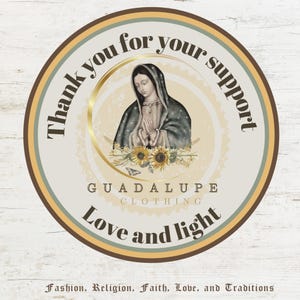 May include: A round sticker with a cream background and a brown border. The image features a religious illustration of a woman with a dark blue cloak, sunflowers, and the text "Thank you for your support." The text "GUADALUPE CLOTHING" and "Love and light" are also included.