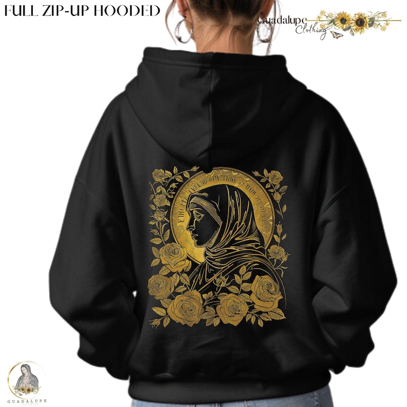 May include: Black full-zip hooded sweatshirt with a gold illustration on the back. The illustration features a religious figure surrounded by roses and text. The sweatshirt has a drawstring hood and a Guadalupe Clothing logo.