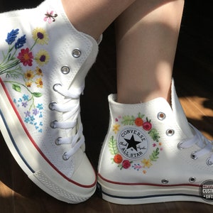 Converse with top designs on them