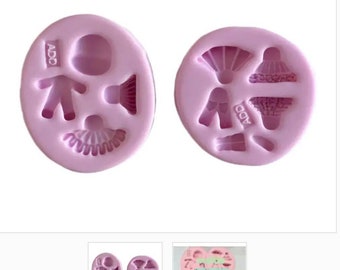 Puede incluir: Dos moldes de silicona rosa para hacer decoraciones de fondant o pasta de goma. Un molde tiene una muñeca, un sombrero y un vestido. El otro molde tiene un vestido, un sombrero, zapatos y un abanico.