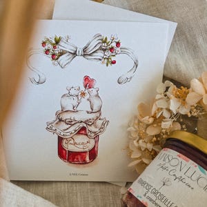 Könnte beinhalten: Eine Grußkarte mit einer Aquarellillustration von zwei Mäusen auf einem Marmeladenglas, die einen herzförmigen Lutscher halten. Die Karte zeigt eine weiße Schleife mit floralen Akzenten und dem Wort "Douceur". Ein Marmeladenglas ist im Hintergrund zu sehen.