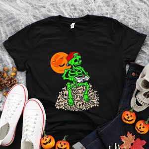 Cute Halloween Skeleton  Game boy Shirt, Halloween Shirt, Funny boys gamer Halloween kids shirt, Trick or Skeleton playing games on bones