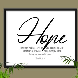 May include: Black and white framed print with the word "Hope" in a cursive font. The print includes a Bible verse from Jeremiah 29:11, "For I know the plans I have for you... plans to prosper you and not to harm you, plans to give you hope and a future."