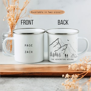 May include: White enamel camping mug with a black mountain scene and the text "THE ADVENTURE BEGINS". The other side of the mug has the text "PAGE . ZACH".