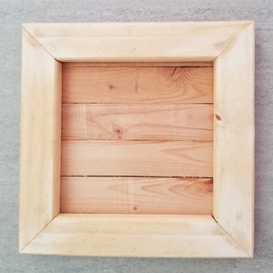 Handmade wooden frame for displaying art, crafts and memorabilia