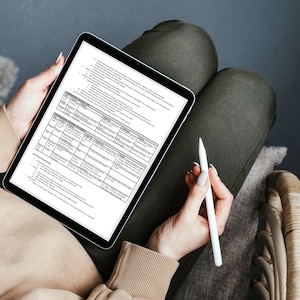 May include: A person is sitting in a chair and using a digital tablet and stylus to complete a form. The form is a table with multiple columns and rows. The form is titled "Application for Employment".