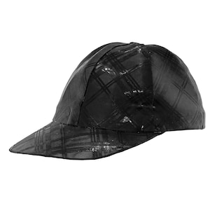 May include: A black baseball cap with a checkered pattern.