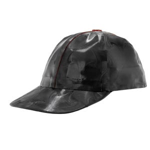 May include: A black baseball cap with a red stitching detail and a black and white abstract pattern.