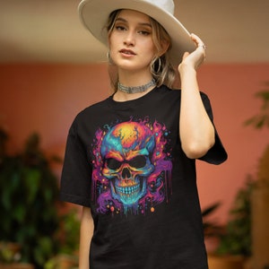 May include: Black t-shirt featuring a colourful skull graphic. The skull is surrounded by flames and dripping paint. The colours are vibrant and include pink, blue, yellow, and orange.