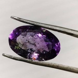 Natural Purple Amethyst Super Seven Gemstone: Faceted Oval Cacoxenite, 7 Carats (10x15x7 mm)