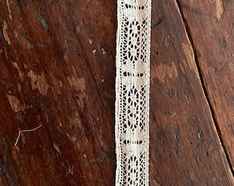 Cotton lace insert. Half inch width. Sold as one length: three yards, thirty three inches.