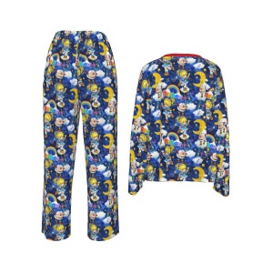 May include: Blue pajamas with a colorful print of a cartoon character with a rainbow and the word "Rainbow" on a blue background with clouds and a crescent moon.