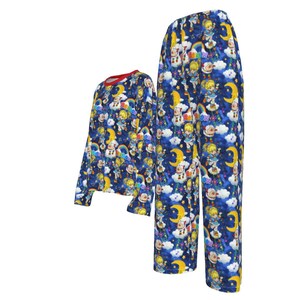 May include: Blue pajamas with a long-sleeved top and pants. The pajamas feature a repeating pattern of a cartoon character with a rainbow and a crescent moon on a blue background.