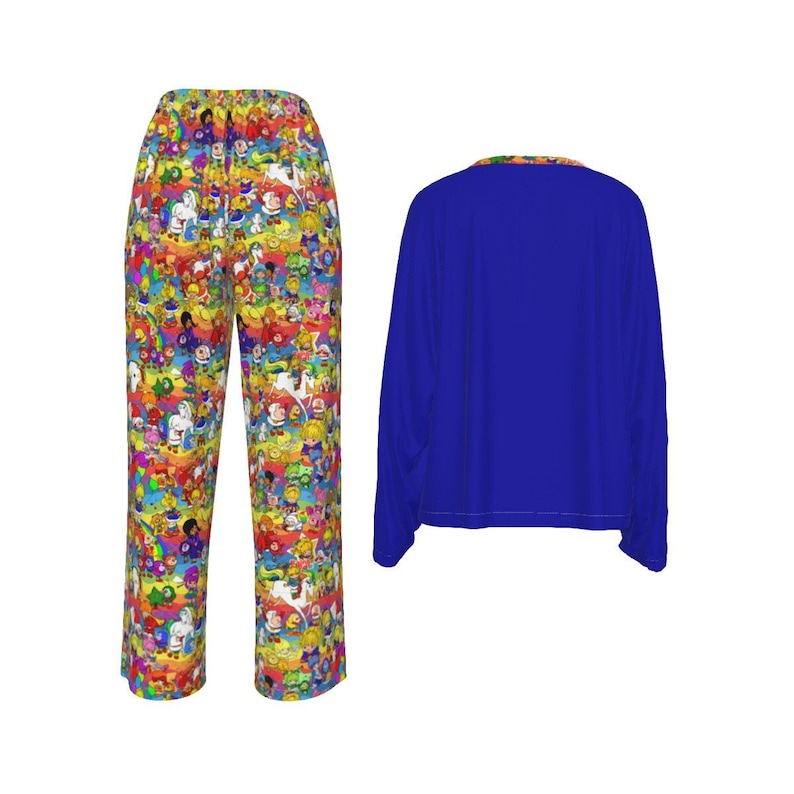 May include: A pajama set featuring colorful cartoon characters. The pants have a vibrant pattern of various cartoon figures on a yellow background. The long-sleeved top is solid blue with a patterned collar.