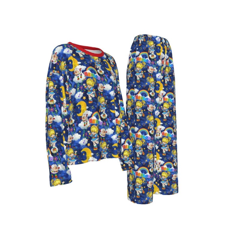 May include: Blue pajamas with a long-sleeved top and pants. The pajamas feature a repeating pattern of a cartoon character with a rainbow and the word "Rainbow" on a blue background with white clouds and stars.